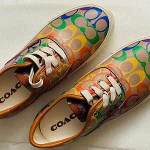 Signature coated canvas and leather 
Rubber outsole
Lace-up closure